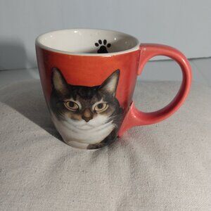 Lang: Piglet Smith, cat mug artwork by Lowel Herrero.